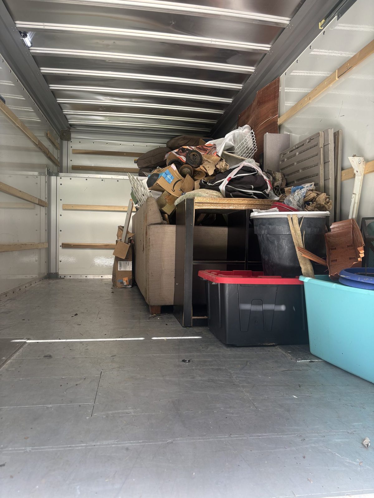 Commercial junk removal crew clearing office furniture and business equipment in Charlottesville VA