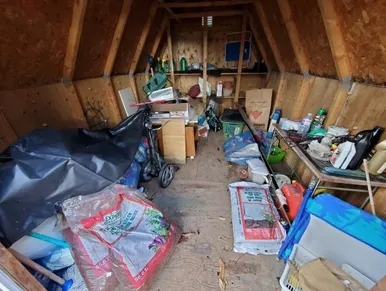 Garage filled with household junk and renovation debris in Pantops Charlottesville