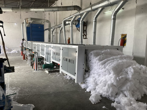 Industrial textile processing equipment in a historic mill facility