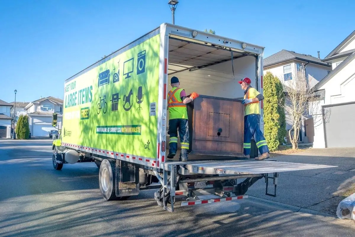 Crew removing a large furniture item from a home in Charlottesville VA